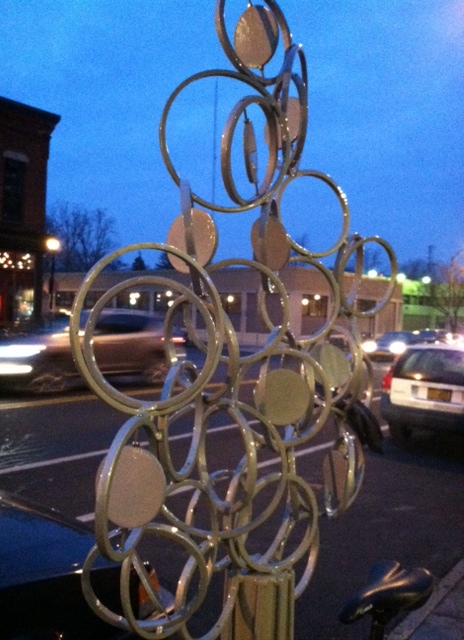 Functional city art in the form of a bike parking post.